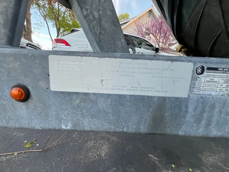 Slide: The Image of Trailer frame with label for 2014 Sea Ray 260 Sundancer boat. - 37