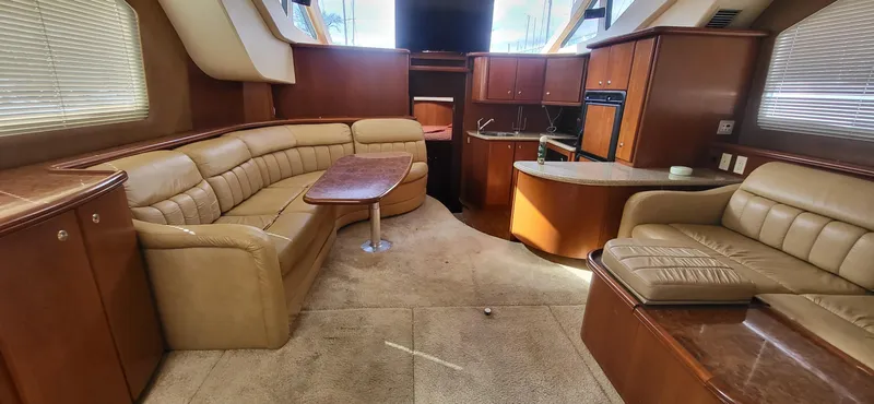 Slide: The Image of Luxurious interior of a 2007 Silverton 43 Motor Yacht with leather seating and modern amenities. - 2