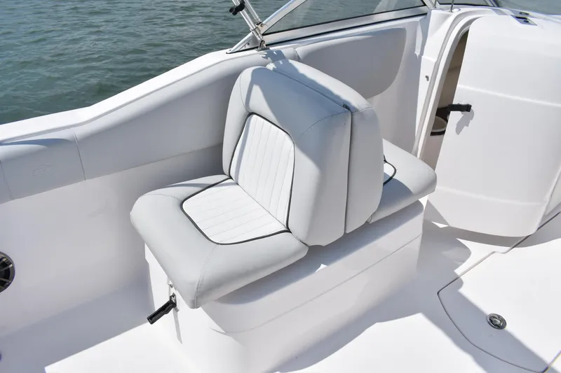 Slide: The Image of 2020 Sea Fox 226 Traveler boat seat, white and gray upholstery, on calm water. - 7
