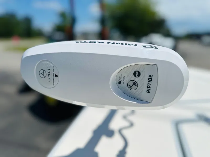 Slide: The Image of Minn Kota Riptide motor on 2022 Hewes Redfisher 18 boat, close-up view. - 11