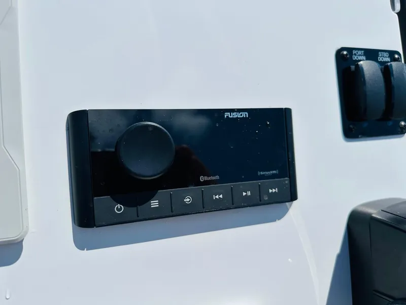 Slide: The Image of Fusion audio system on 2022 Hewes Redfisher 18 boat dashboard. - 4