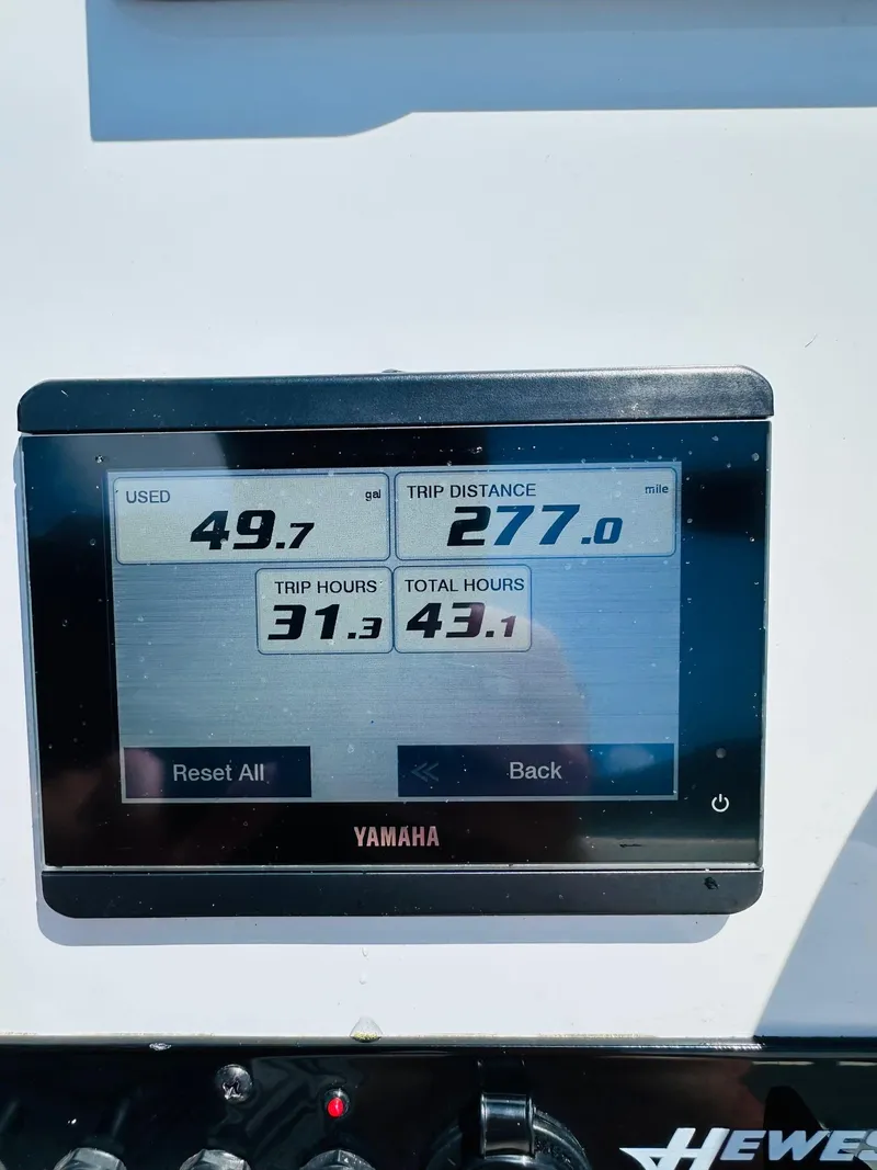 Slide: The Image of Yamaha display on 2022 Hewes Redfisher 18 showing trip data and engine hours. - 5