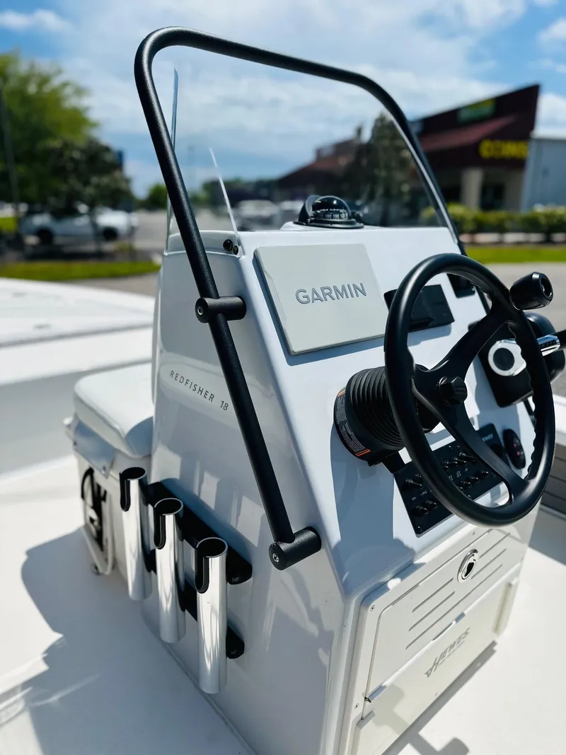 Slide: The Image of 2022 Hewes Redfisher 18 boat console with Garmin navigation system and rod holders. - 6