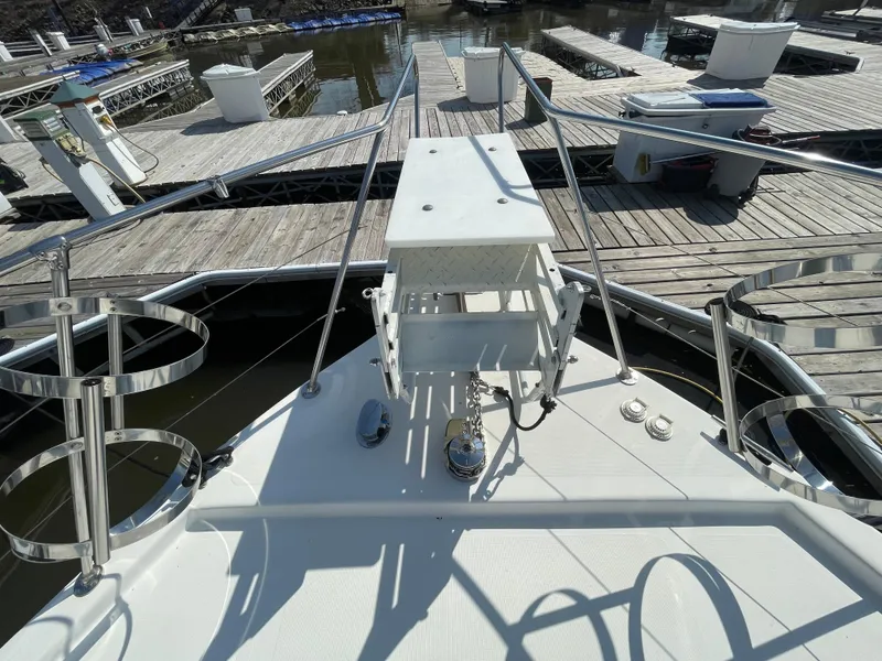 Slide: The Image of 1984 Bluewater 42 Coastal Cruiser at marina dock, showcasing bow and deck features. - 12