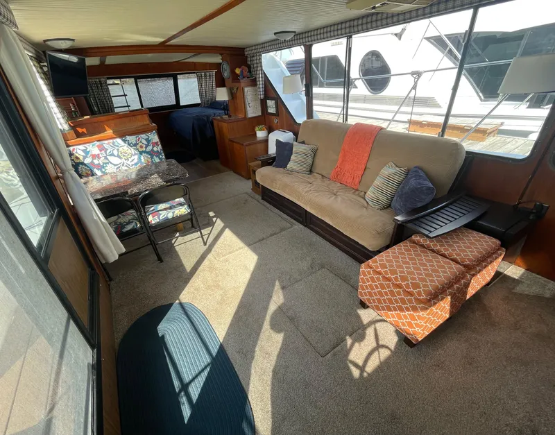 Slide: The Image of Interior of 1984 Bluewater 42 Coastal Cruiser with cozy seating and nautical decor. - 21