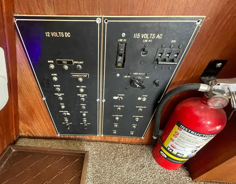 Slide: The Image of Electrical panel and fire extinguisher on 1984 Bluewater 42 Coastal Cruiser boat. - 26