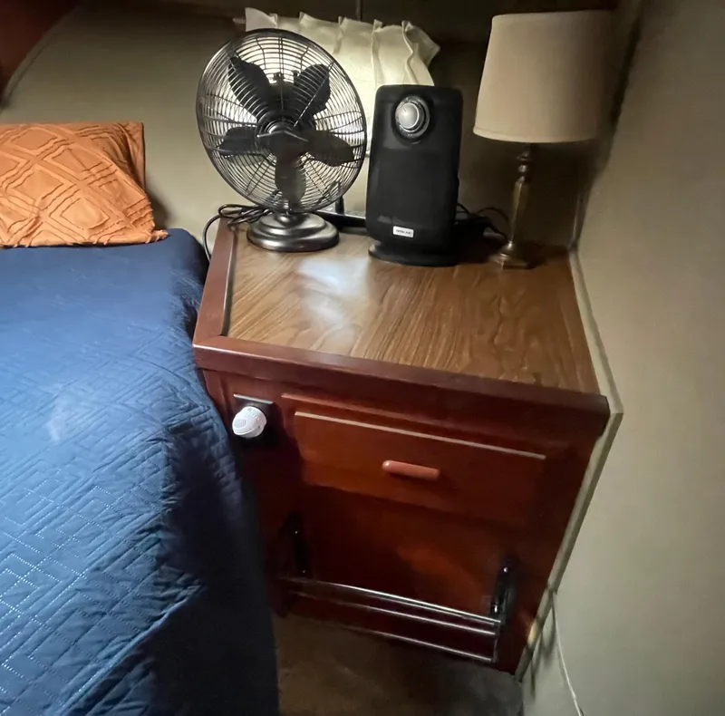 Slide: The Image of Cozy cabin interior of 1984 Bluewater 42 Coastal Cruiser with fan, speaker, and lamp. - 32