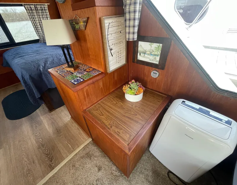 Slide: The Image of Interior of 1984 Bluewater 42 Coastal Cruiser with wood paneling and cozy decor. - 40