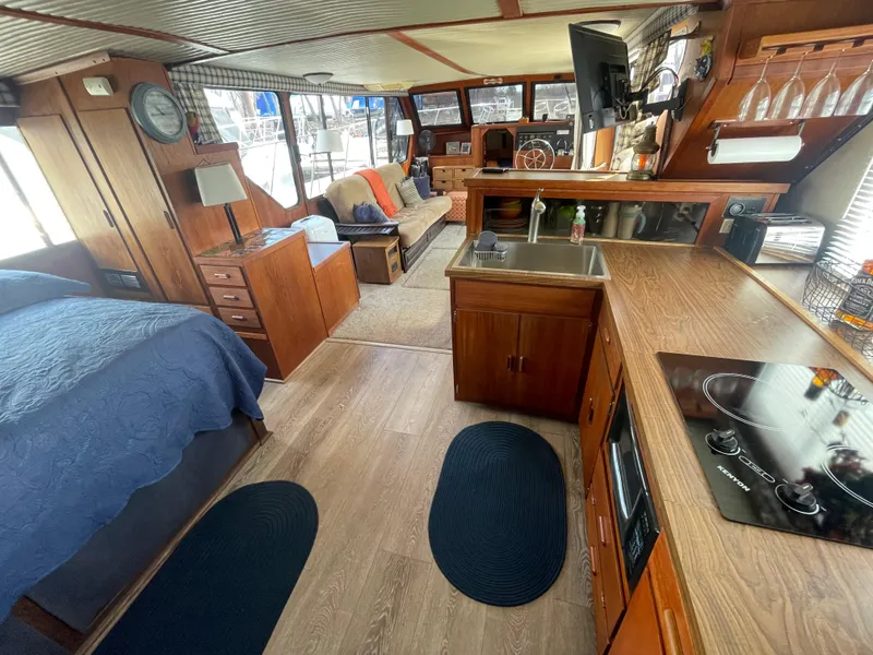 Slide: The Image of Interior of 1984 Bluewater 42 Coastal Cruiser with kitchen, seating, and bed. - 46