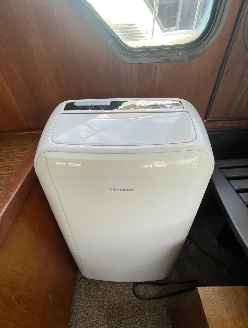 Slide: The Image of Portable air conditioner inside 1984 Bluewater 42 Coastal Cruiser boat cabin. - 49