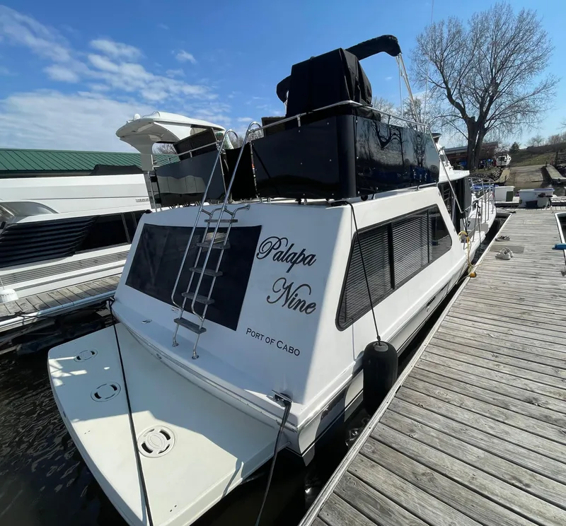 Slide: The Image of 1984 Bluewater 42 Coastal Cruiser docked, featuring "Palapa Nine" on the stern. - 6