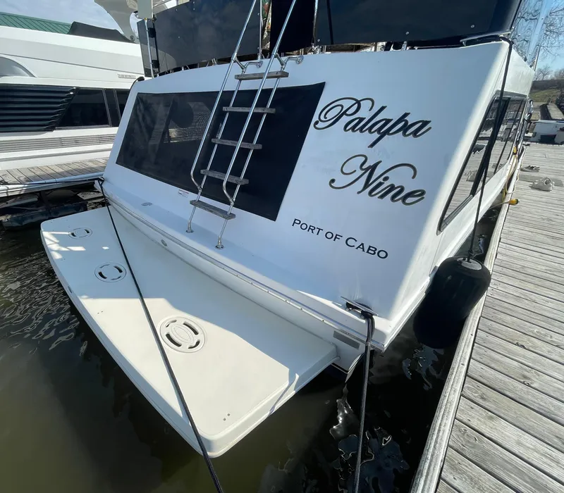 Slide: The Image of 1984 Bluewater 42 Coastal Cruiser docked, featuring "Palapa Nine" and "Port of Cabo" on the stern. - 7