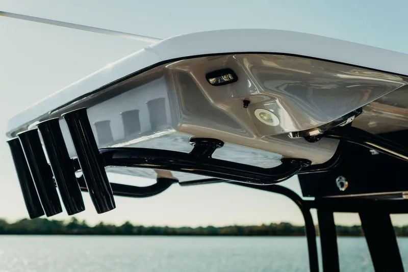 Slide: The Image of 2025 Key West 239FSR boat canopy with rod holders, viewed from below. - 11