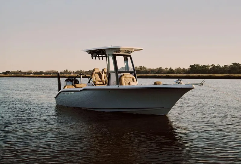 Slide: The Image of 2025 Key West 239FSR boat on calm water at sunset. - 18