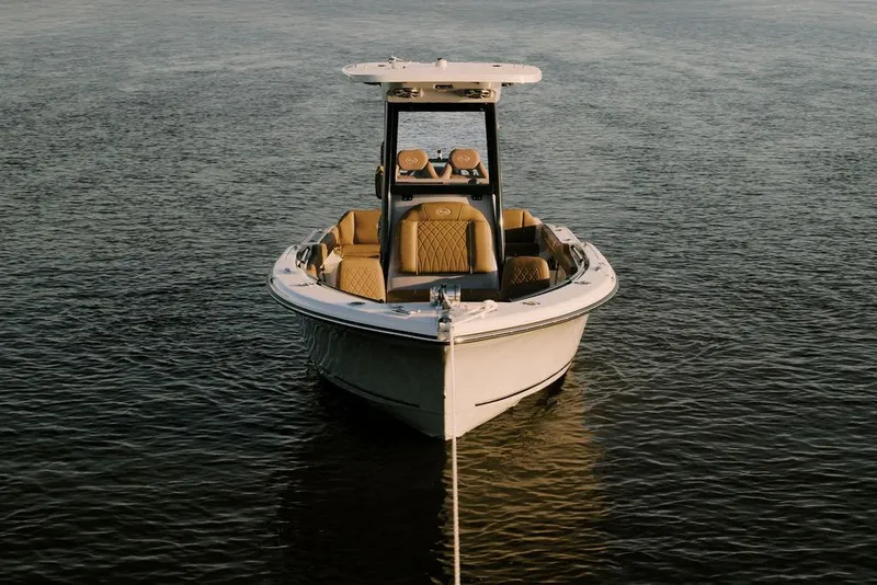 Slide: The Image of 2025 Key West 239FSR boat on calm water, front view, showcasing sleek design. - 5