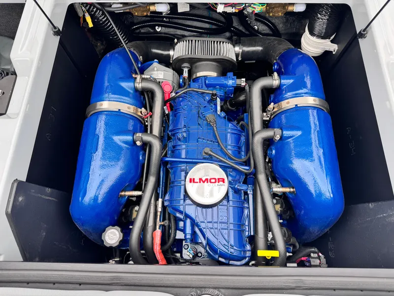 Slide: The Image of 2022 MasterCraft XT21 engine with blue Ilmor components, showcasing powerful marine performance. - 13