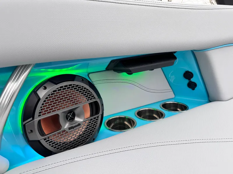 Slide: The Image of Interior of 2022 MasterCraft XT21 boat with speaker, cup holders, and ambient lighting. - 24