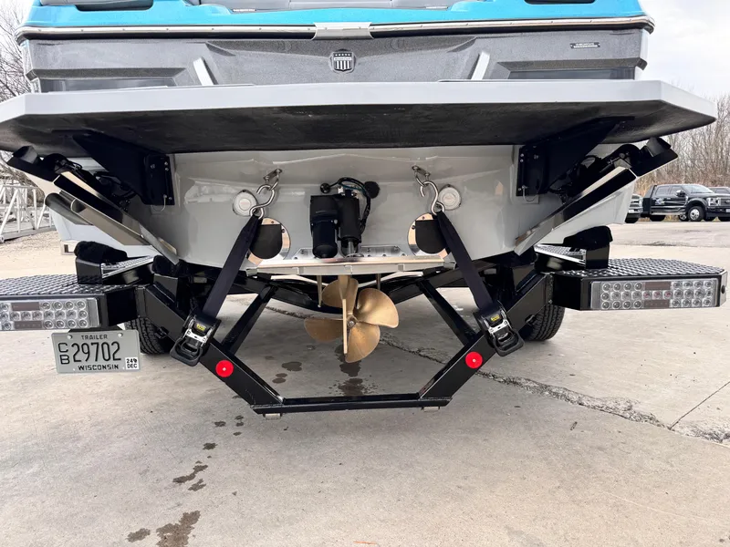 Slide: The Image of 2022 MasterCraft XT21 boat stern with propeller and trim tabs visible. - 4