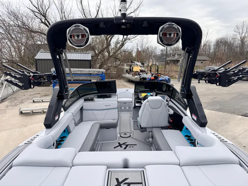 Slide: The Image of 2022 MasterCraft XT21 boat with sleek interior and advanced sound system. - 6