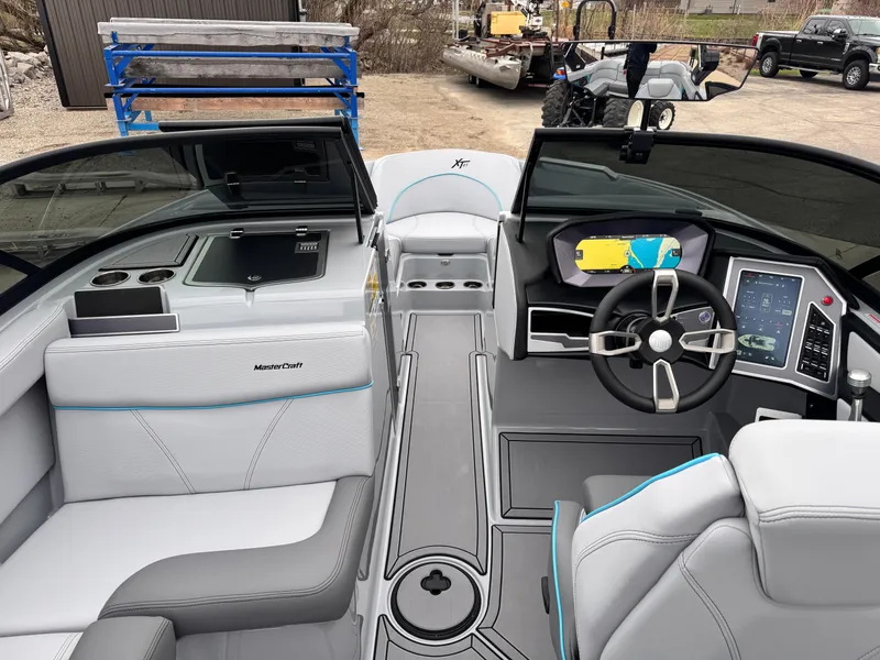 Slide: The Image of Interior of a 2022 MasterCraft XT21 boat with modern dashboard and seating. - 8