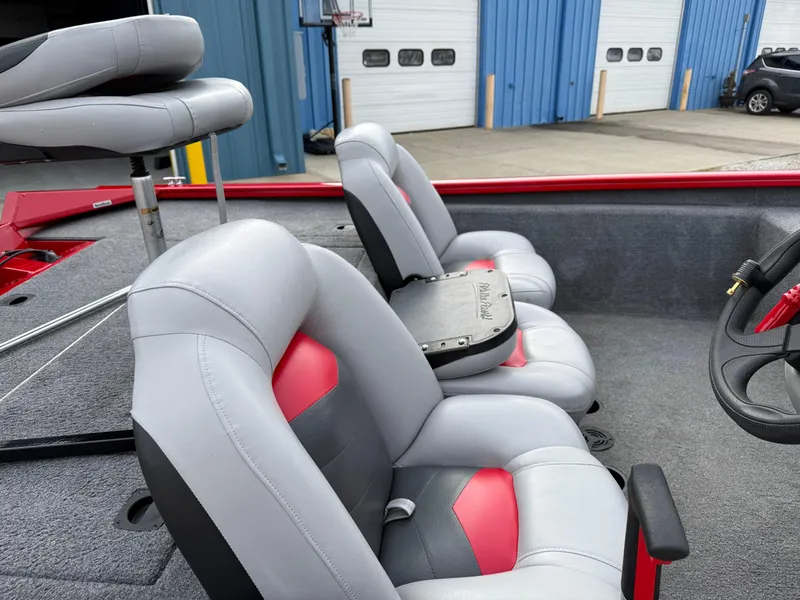 Slide: The Image of 2016 Tracker Pro Team 175 TXW boat interior with gray and red seating. - 6