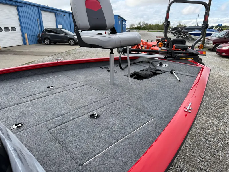 Slide: The Image of 2016 Tracker Pro Team 175 TXW fishing boat with red trim and swivel seat. - 7