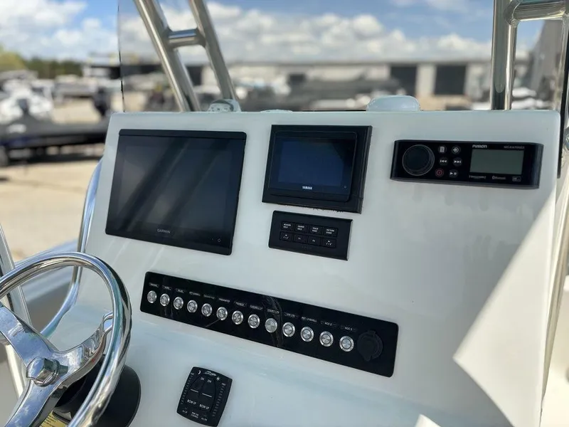 Slide: The Image of 2022 Key West 239FS boat dashboard with modern navigation and control systems. - 10
