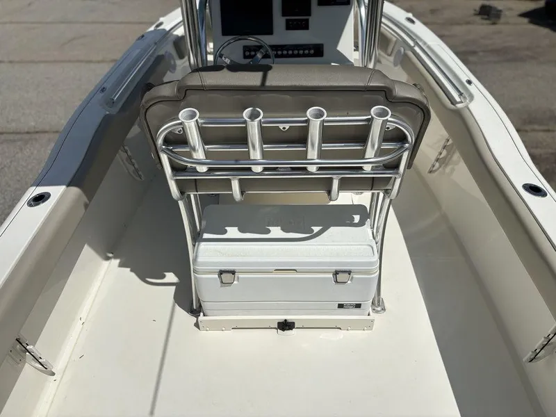 Slide: The Image of 2022 Key West 239FS boat interior with rod holders and cooler. - 11