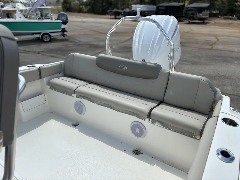 Slide: The Image of 2022 Key West 239FS boat with cushioned seating and sleek design. - 15
