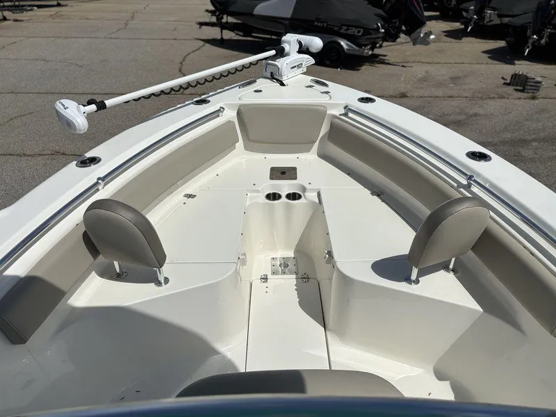 Slide: The Image of 2022 Key West 239FS boat interior with seating and trolling motor. - 16