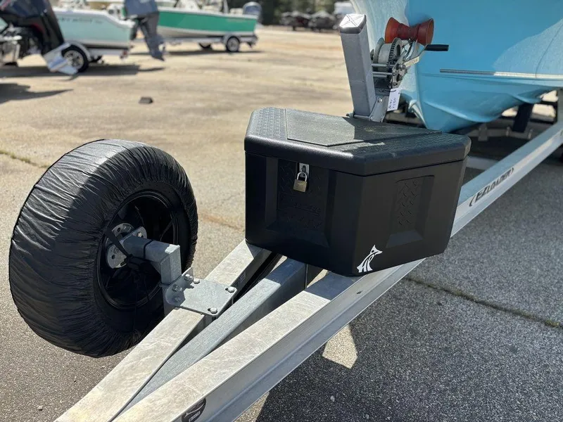 Slide: The Image of Trailer with a 2022 Key West 239FS boat, featuring a black storage box and covered wheel. - 18