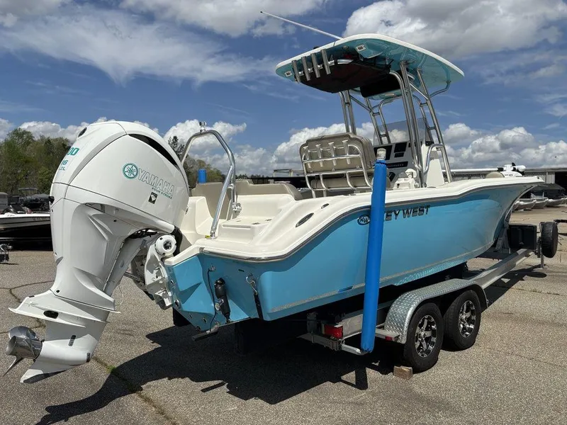 Slide: The Image of 2022 Key West 239FS boat on trailer, featuring Yamaha outboard motor, under a partly cloudy sky. - 3