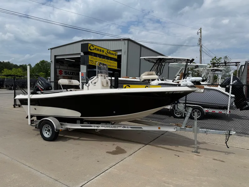 Slide: The Image of 2015 Carolina Skiff 19 Sea Skiff on trailer outside dealership. - 1
