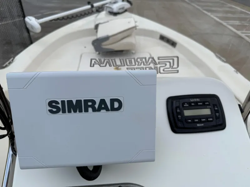Slide: The Image of 2015 Carolina Skiff 19 Sea Skiff with Simrad navigation system on deck. - 13