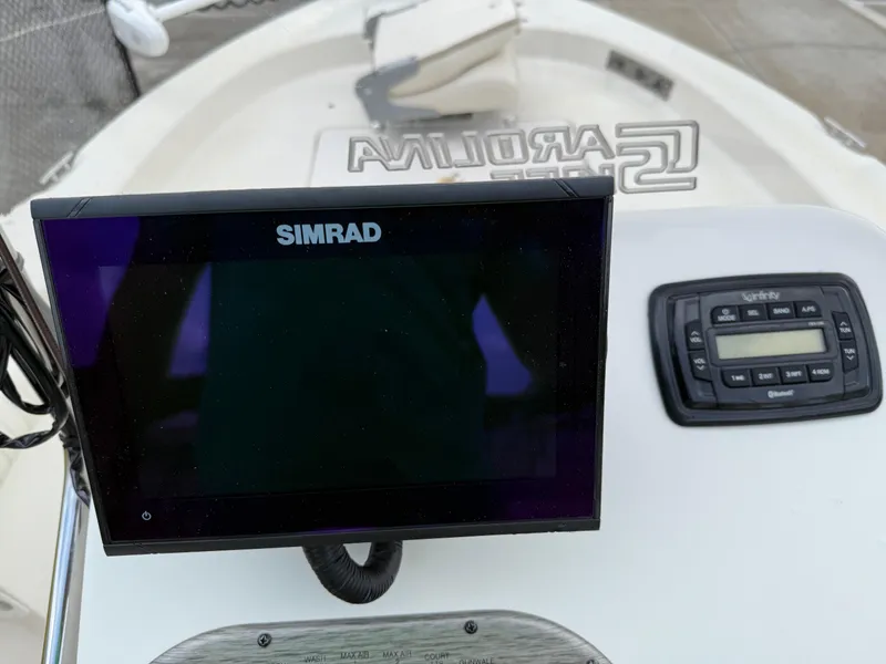 Slide: The Image of Simrad display and controls on 2015 Carolina Skiff 19 Sea Skiff boat dashboard. - 14