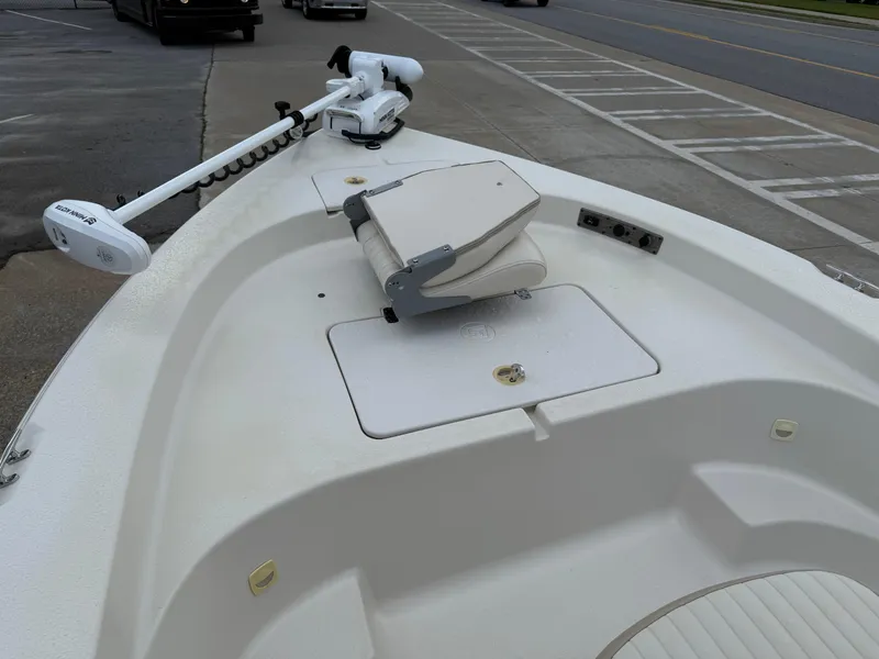Slide: The Image of 2015 Carolina Skiff 19 Sea Skiff boat with trolling motor and seating on deck. - 15