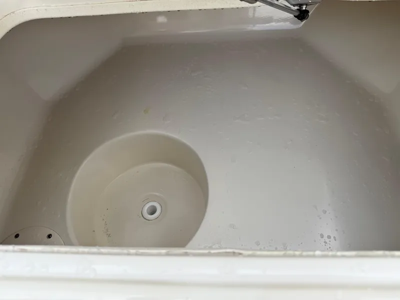 Slide: The Image of 2015 Carolina Skiff 19 Sea Skiff livewell interior, clean and empty. - 16