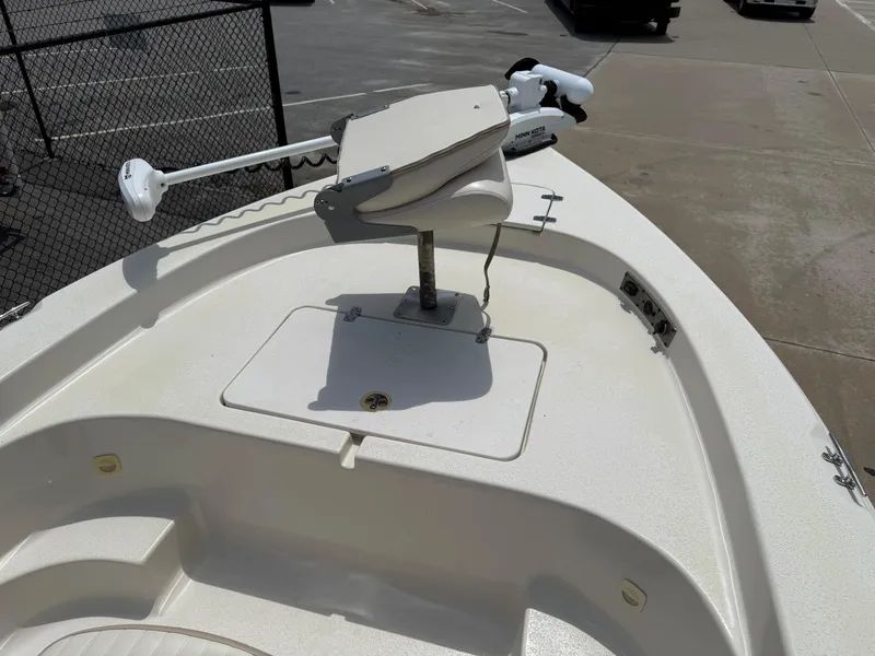 Slide: The Image of 2015 Carolina Skiff 19 Sea Skiff bow with trolling motor and storage hatch. - 19