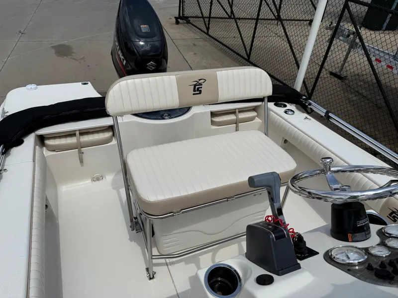 Slide: The Image of 2015 Carolina Skiff 19 Sea Skiff boat interior with steering console and seating. - 20