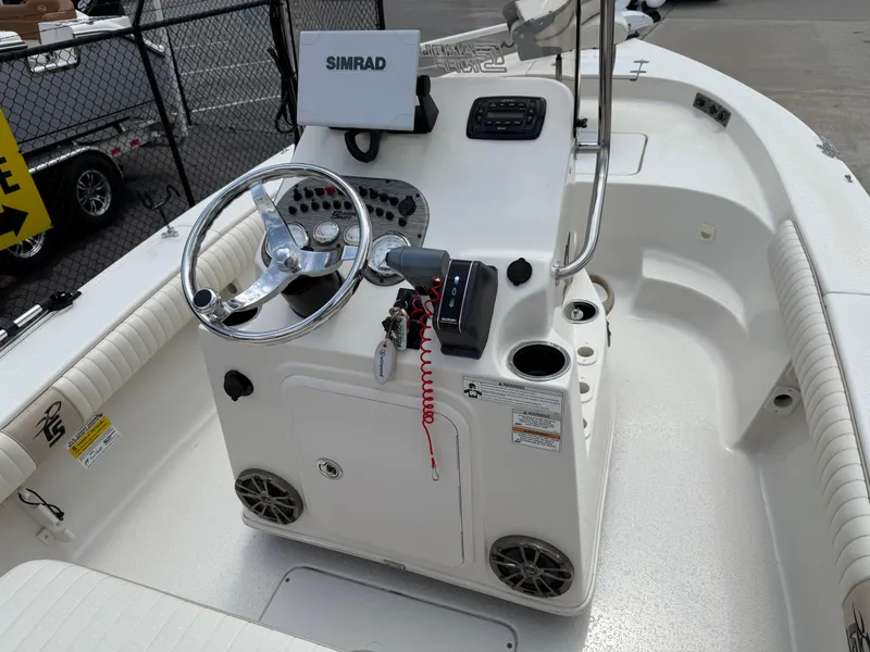 Slide: The Image of 2015 Carolina Skiff 19 Sea Skiff boat console with steering wheel and Simrad display. - 22