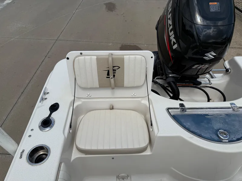 Slide: The Image of 2015 Carolina Skiff 19 Sea Skiff boat interior with Suzuki outboard motor. - 26