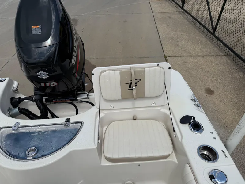 Slide: The Image of 2015 Carolina Skiff 19 Sea Skiff boat interior with seating and motor. - 27