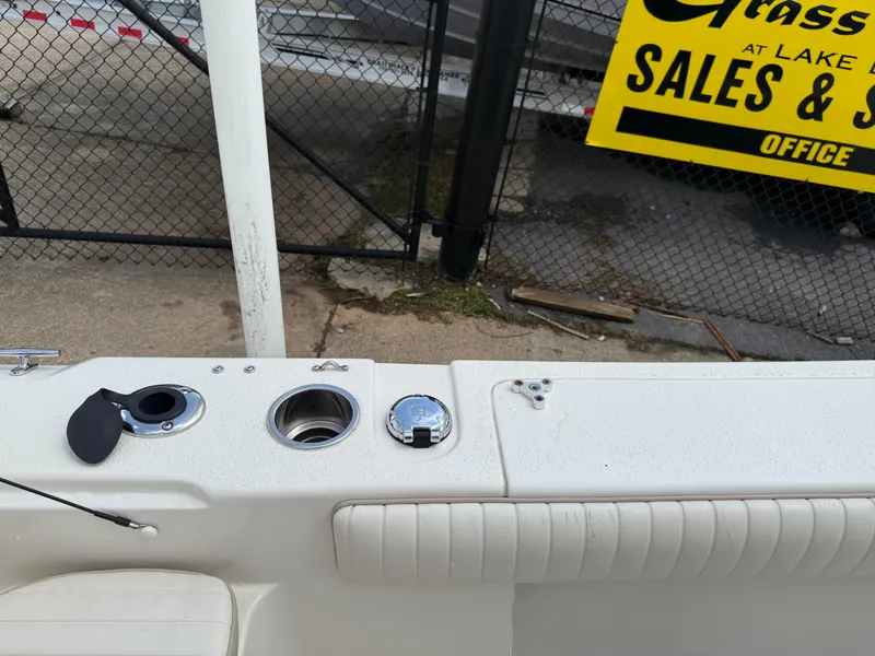 Slide: The Image of 2015 Carolina Skiff 19 Sea Skiff boat interior near sales sign. - 30