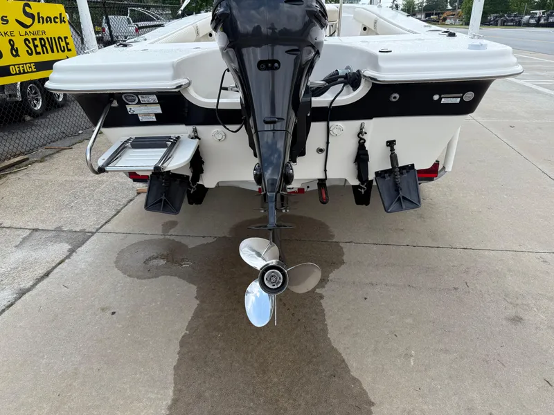 Slide: The Image of 2015 Carolina Skiff 19 Sea Skiff boat rear view with outboard motor and propeller. - 34