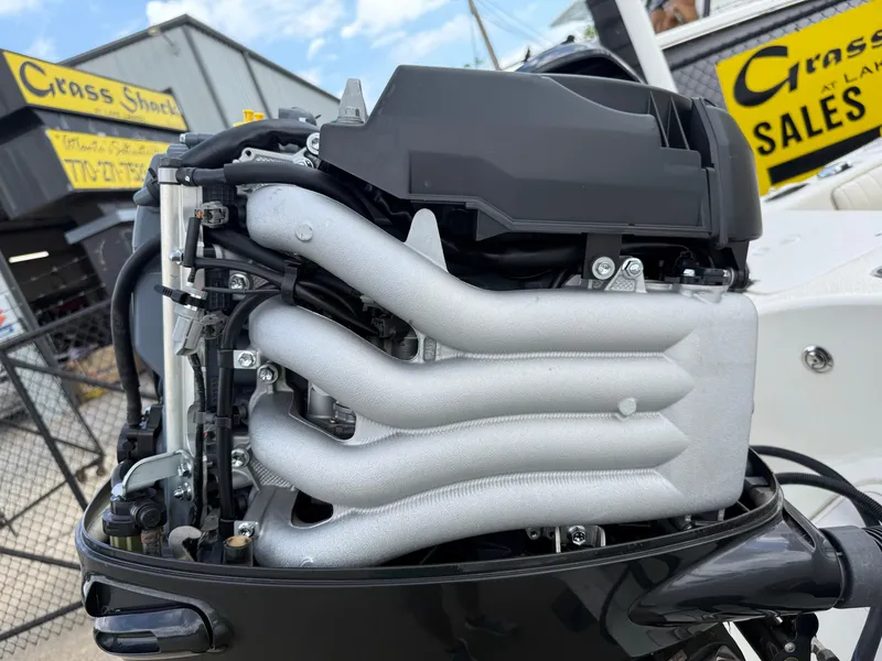 Slide: The Image of 2015 Carolina Skiff 19 Sea Skiff engine close-up at dealership. - 40