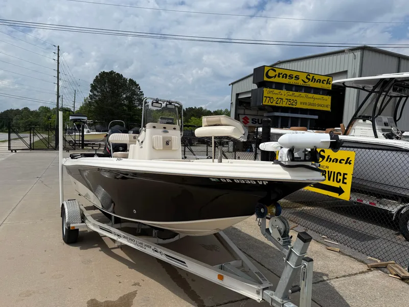 Slide: The Image of 2015 Carolina Skiff 19 Sea Skiff on trailer at dealership, sunny day. - 5