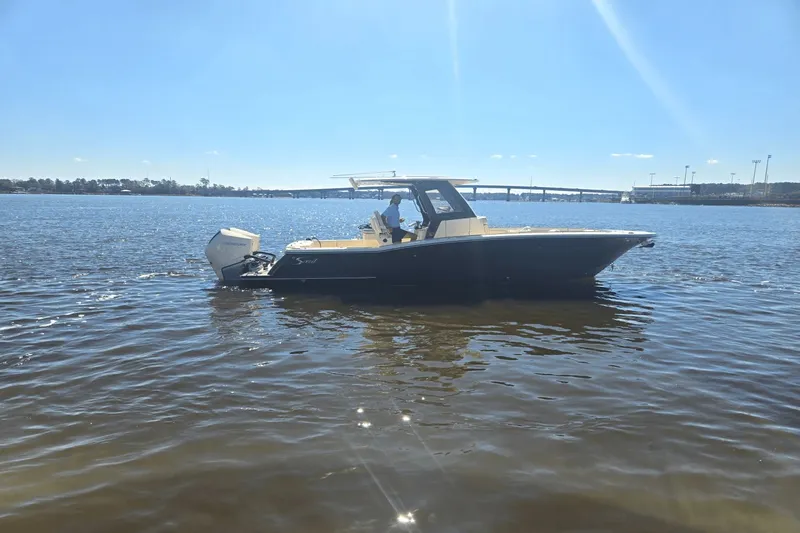 Slide: The Image of Scout 288 LXF 2026 on trailer in front of a building. - 0