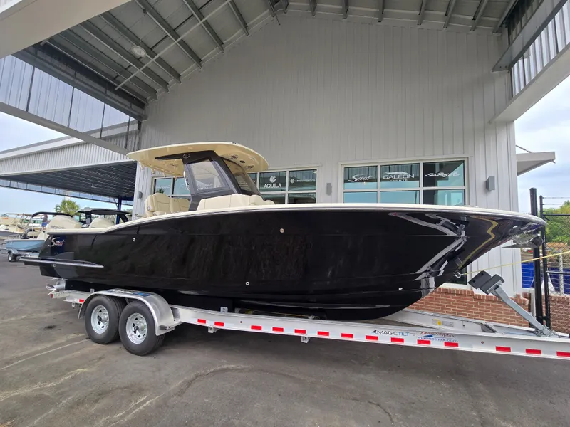 Slide: The Image of Scout 288 LXF 2026 on trailer under covered area. - 40