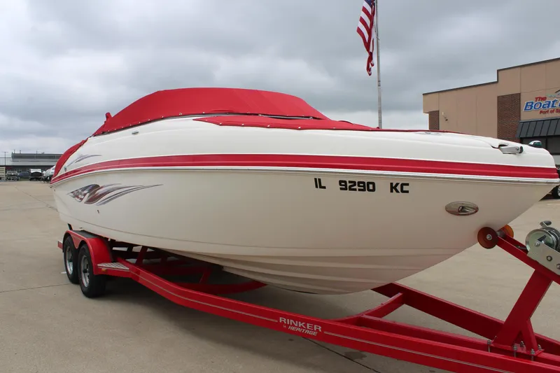 Slide: The Image of 2007 Rinker 246 Captiva Bowrider on red trailer, parked outdoors. - 1
