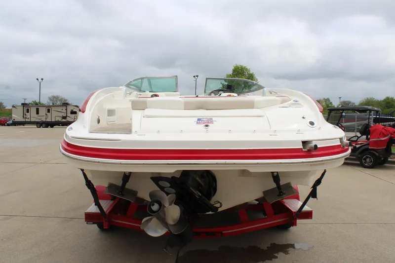 Slide: The Image of 2007 Rinker 246 Captiva Bowrider on trailer, rear view, overcast sky. - 13